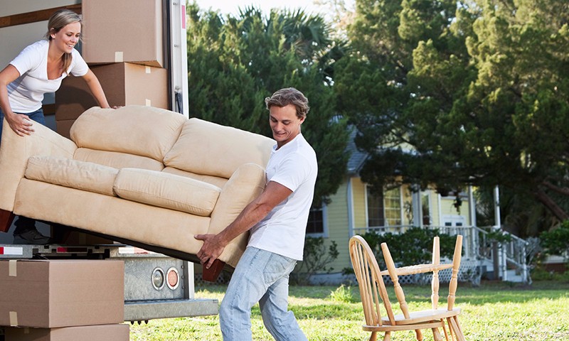 Couple moving furniture