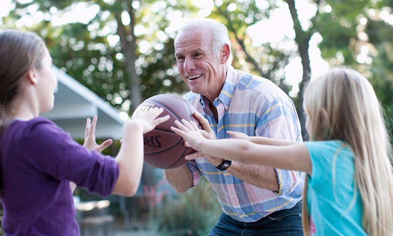 Grandpa and kids playing hoops